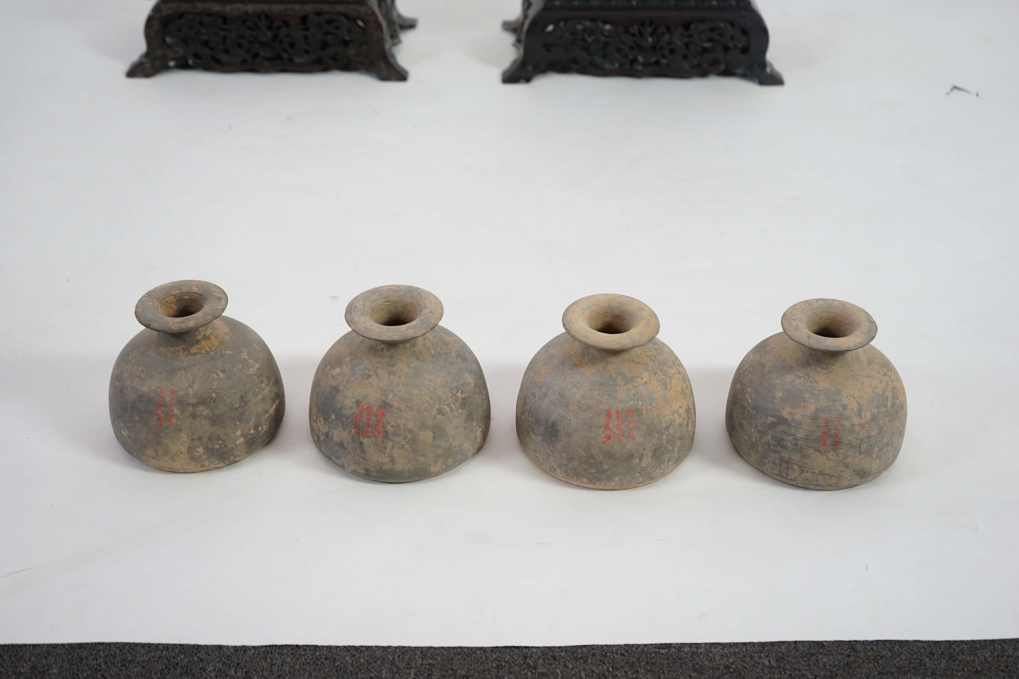 Four very rare Chinese inscribed pottery jars, Han dynasty